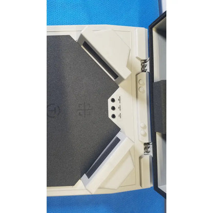 White plastic audioscan verifit vf-1 hearing analyzer with black foam inserts and visible power button panel