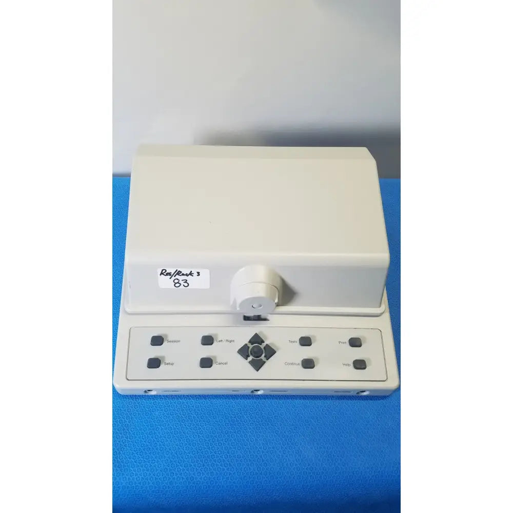 Cream-colored audioscan verifit vf-1 hearing analyzer with rectangular control panel and black buttons for real-ear testing
