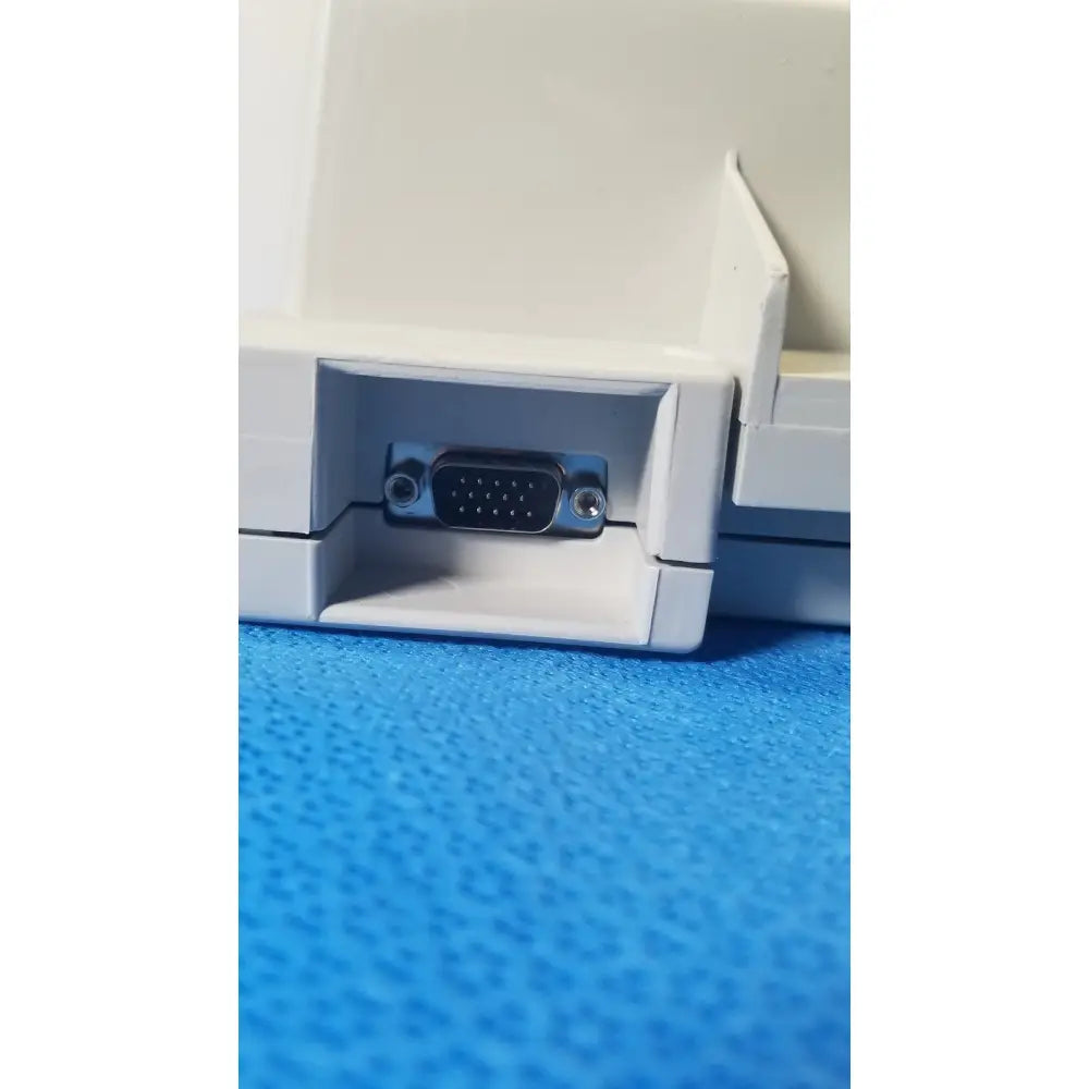 White plastic vga port with metallic connector on the side of audioscan verifit vf-1 hearing analyzer device