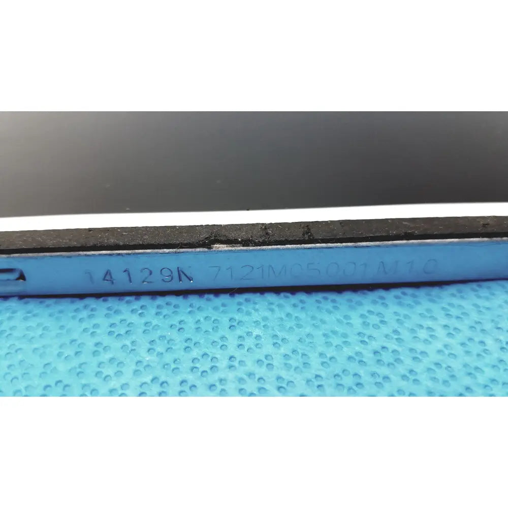 Blue plastic tool with engraved serial numbers and black rubberized edge on the back of auo m215htn01 lcd screen panel