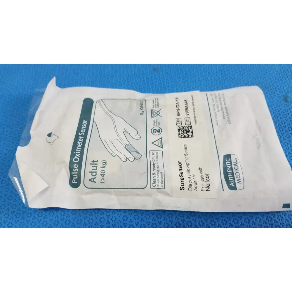 Authentic medical suresensor disposable spo2 sensor in a white and teal pouch with adult use instructions visible