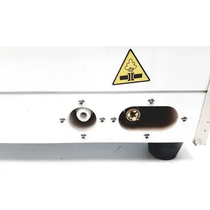 White portable steal autoclave portable steal sterelizer with yellow warning label and circular metallic components