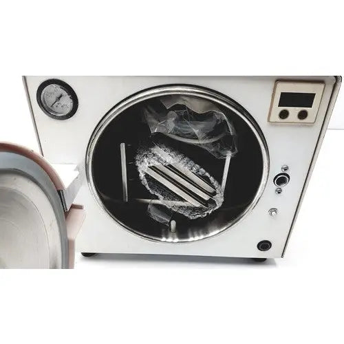 Silver autoclave portable steal sterilizer with circular door pressure gauge and digital controls model tr250nm-1
