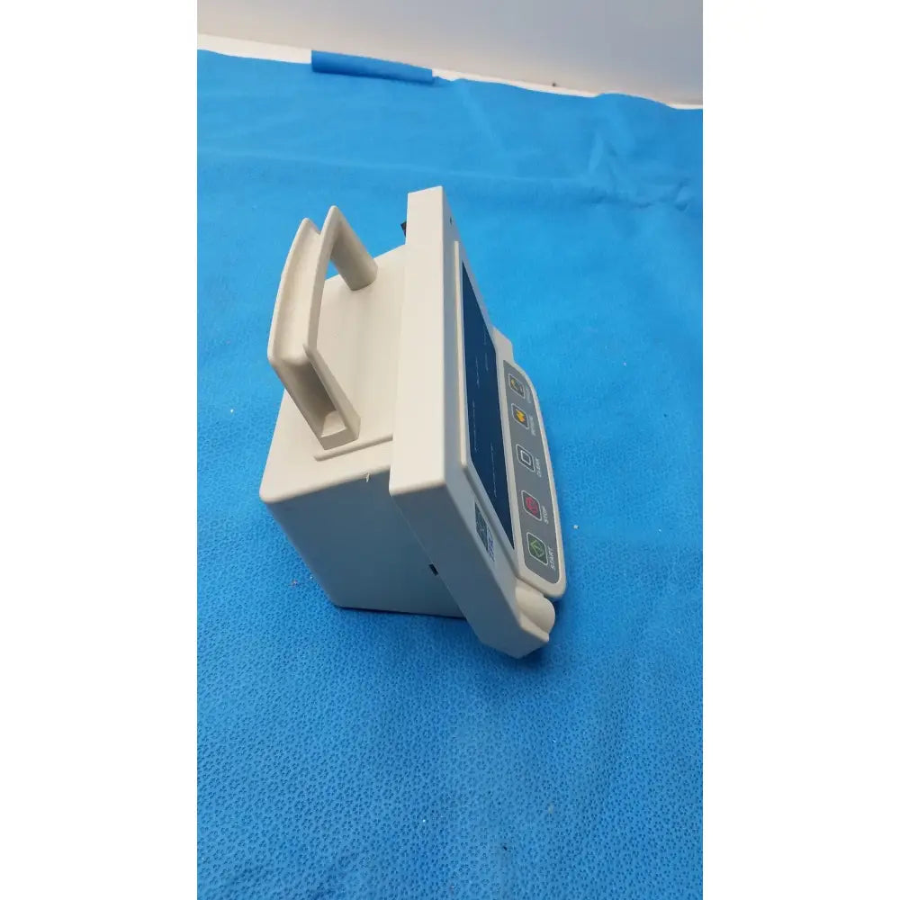White plastic automatic blood pressure monitor infusion pump with handle and control buttons for medical use