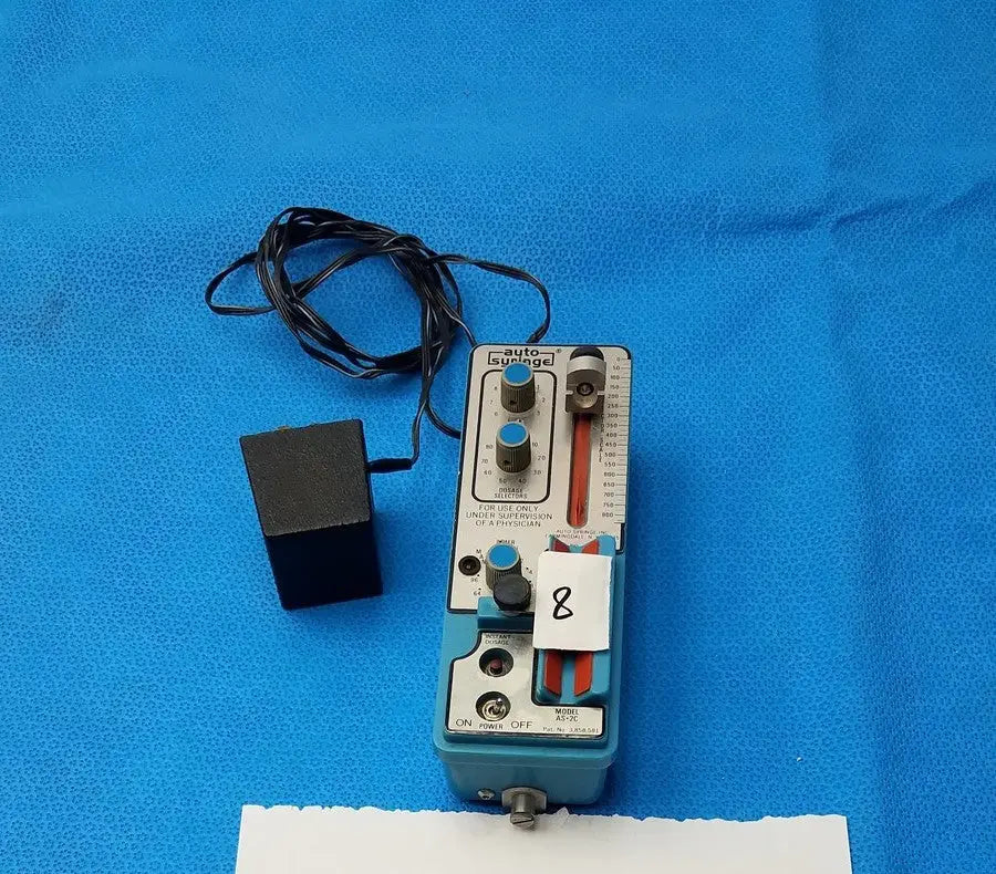 Light blue automatic dispensing module with silver knobs red dial and black cables for precise automatic dispensing