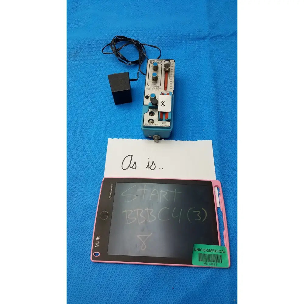 Pink-framed mafin lcd writing tablet with black screen displaying handwritten text for automatic dispensing module use