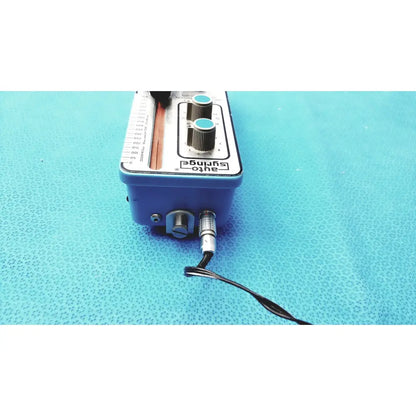 Blue automatic dispensing module electronic device with silver knobs and black cable for precise automatic dispensing