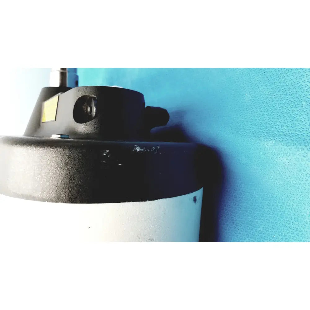 Black and white cylindrical variable speed grinder-polisher 120v with metallic top component for precision lab use