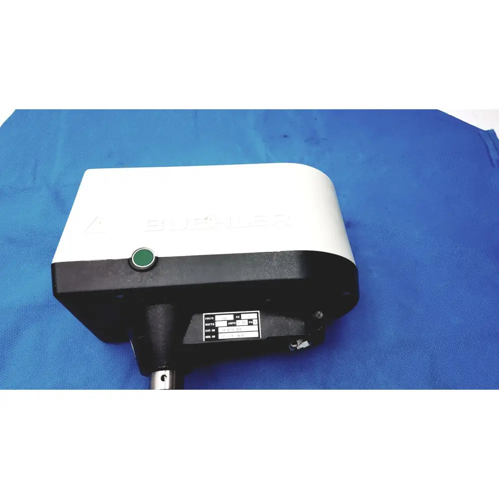 White and black buehler automet 2 variable speed grinder-polisher 120v with green circular button on front panel