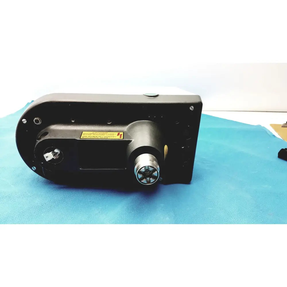 Black industrial variable speed grinder-polisher 120v with metallic cylindrical component and yellow warning label