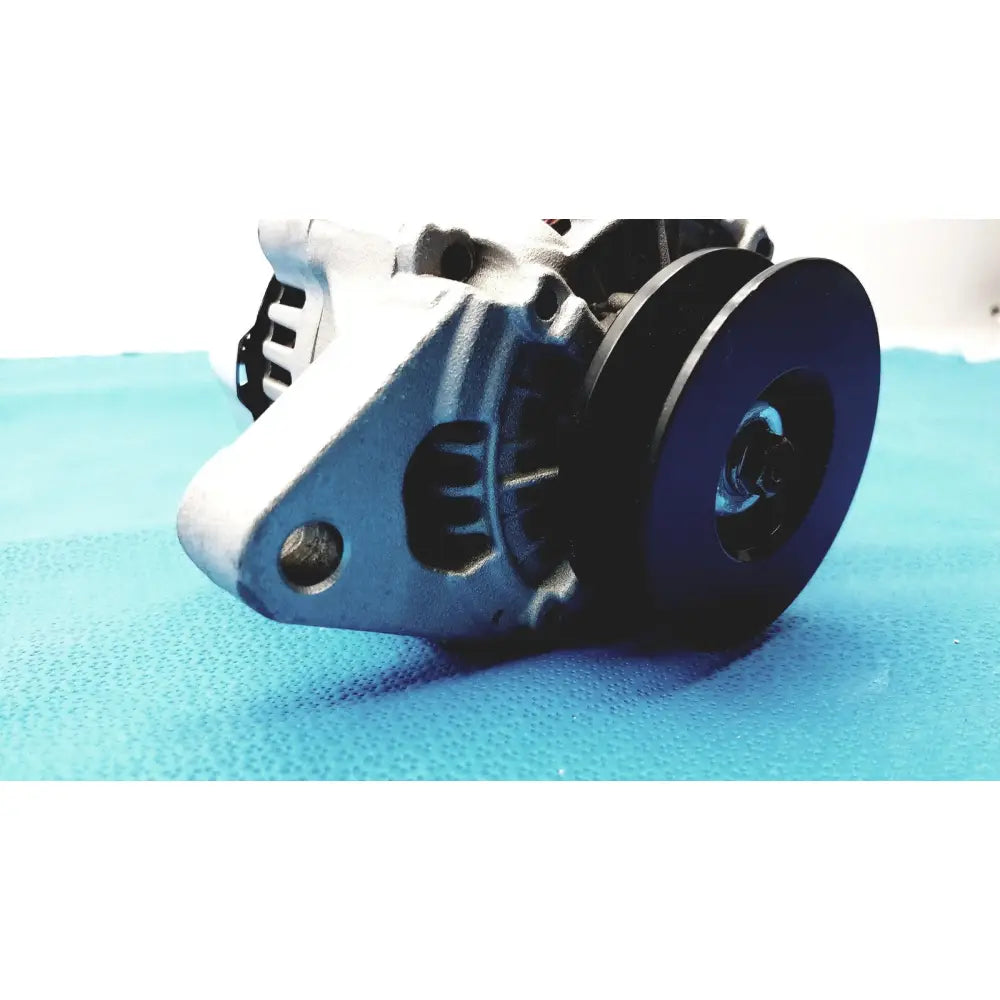Silver metallic automotive alternator for spare with black pulley and ribbed cooling fins designed for efficient reuse medical use