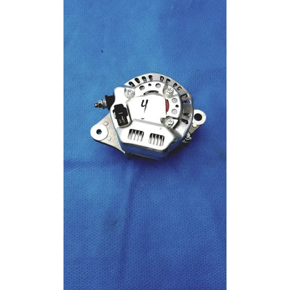 Silver automotive alternator with black plastic connector and red accent featuring metallic housing and ventilation slots for reuse medical