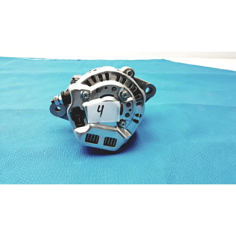 Silver metallic automotive alternator with ribbed housing and bolted mounting points for spare reuse medical applications