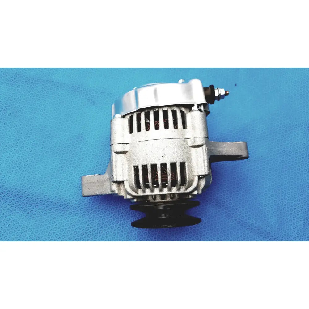 Silver-colored automotive alternator made of aluminum with black pulley and mounting bracket for reuse medical spare purposes