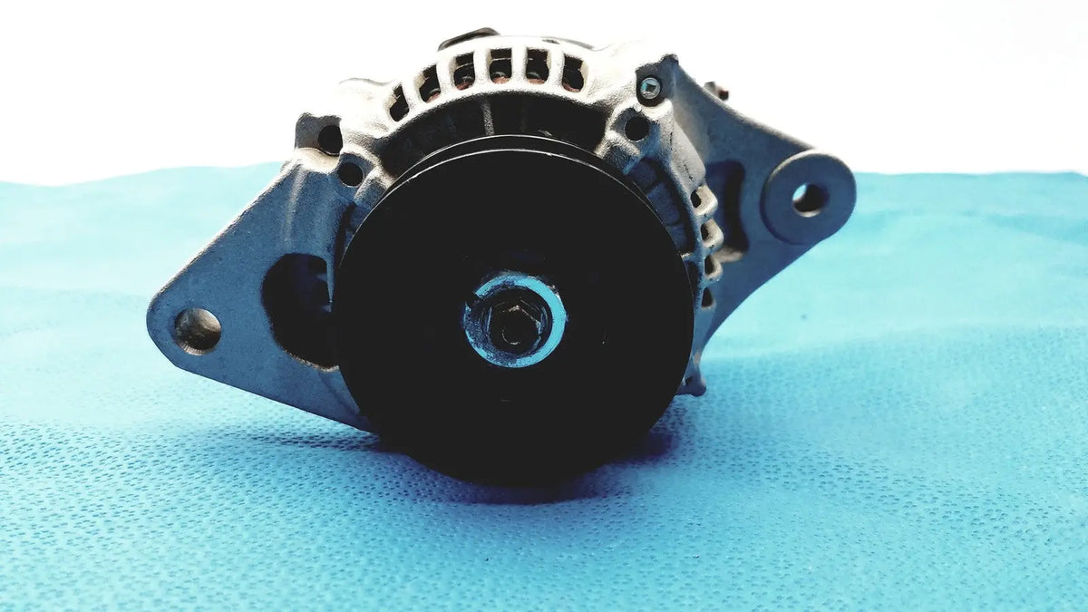 Black and silver automotive alternator with ribbed housing and mounting brackets for automotive alternator reuse medical spare