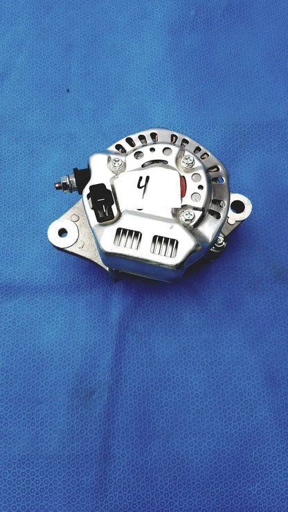 Silver automotive alternator with black plastic connector and red accent featuring metallic housing and ventilation slots for reuse medical
