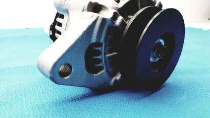 Silver metallic automotive alternator for spare with black pulley and ribbed cooling fins designed for efficient reuse medical use