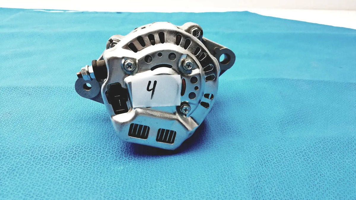 Silver metallic automotive alternator with ribbed housing and bolted mounting points for spare reuse medical applications
