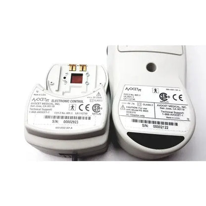 White plastic avosure pt pro+ prothrombin time system device with gold contacts and red square component on top surface