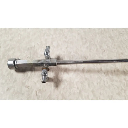 Silver-colored metal bainha externa richard wolf 8853.05 surgical instrument with long shaft and three perpendicular ports