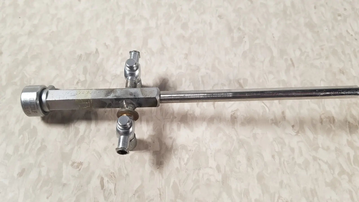 Silver-colored metal bainha externa richard wolf 8853.05 surgical instrument with long shaft and three perpendicular ports