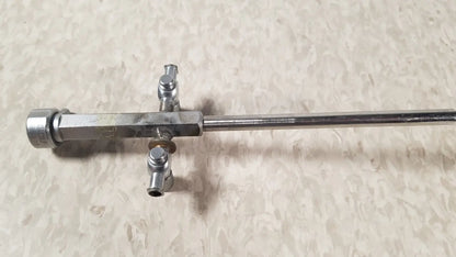 Silver-colored metal bainha externa richard wolf 8853.05 surgical instrument with long shaft and three perpendicular ports