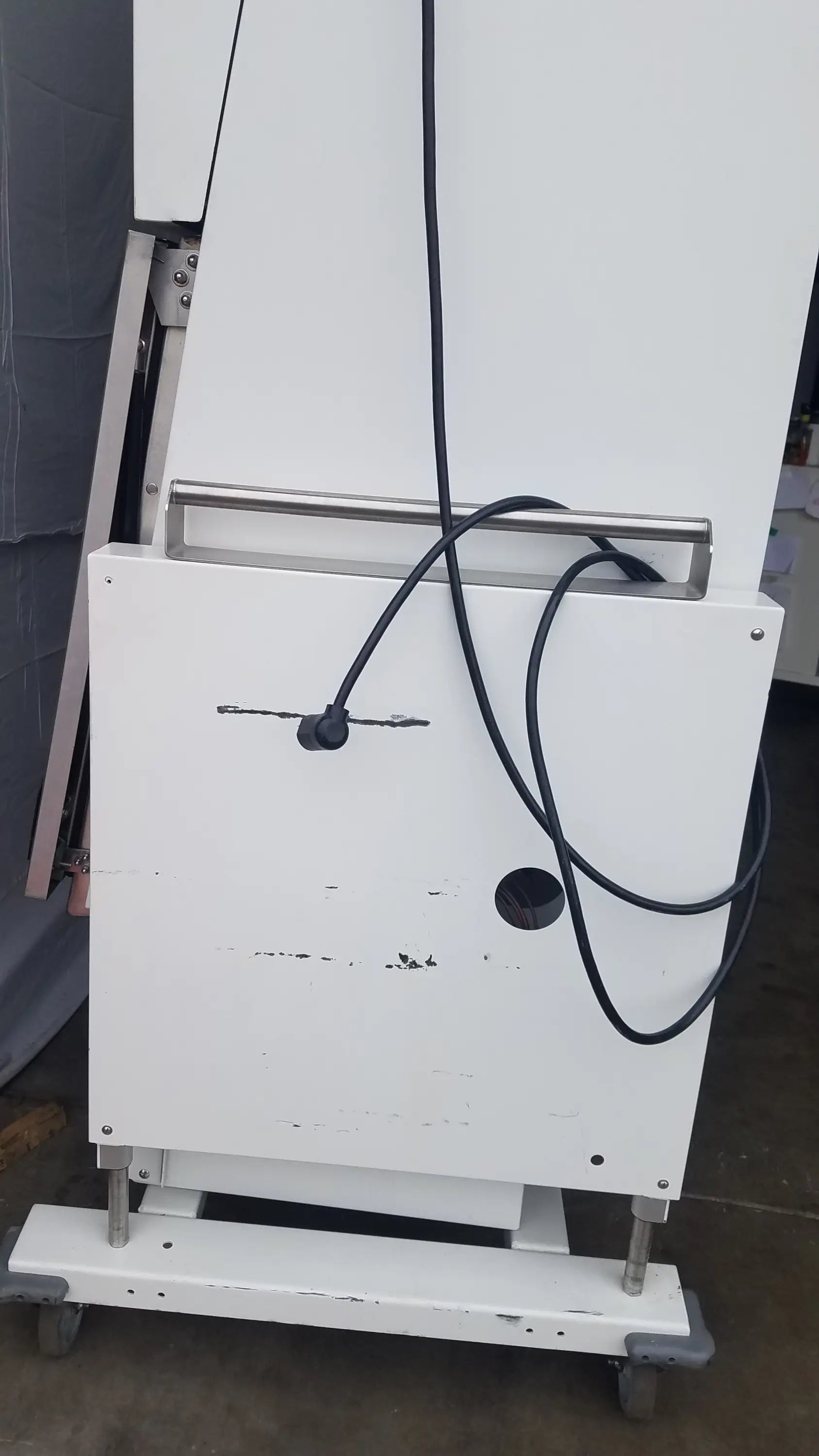 White Baker SS-600 sterilshield positive pressure isolator with metallic handle and black cables for controlled environments
