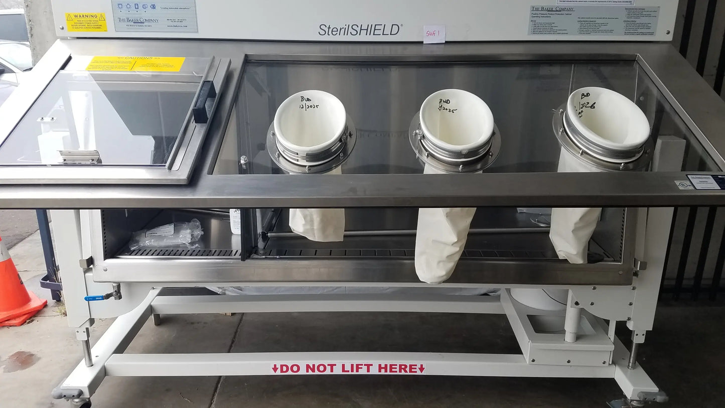 Baker SS-600 Sterilshield stainless steel positive pressure isolator with three white sterile containers inside
