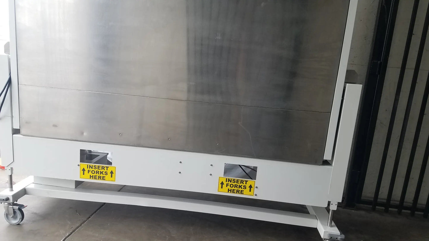Industrial stainless steel forklift truck with white base and yellow labels for baker ss-600 sterilshield positive pressure isolator