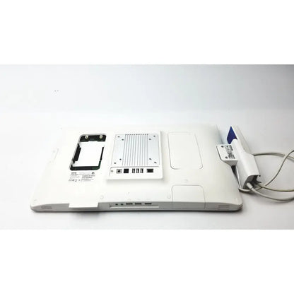Back view of a white barco ja018 smart terminal with silver metal cooling fan and usb ports for bedside multi-touch use