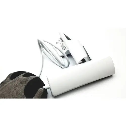 White cylindrical barco jaohandset hs000aipcba1 charging station with integrated cable management for reuse medical settings