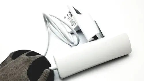 White cylindrical barco jaohandset hs000aipcba1 charging station with integrated cable management for reuse medical settings