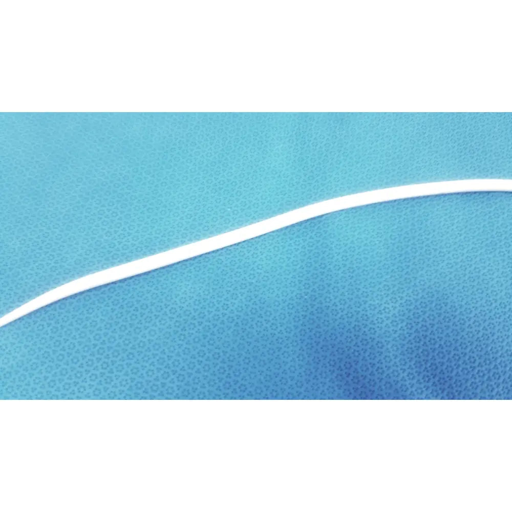 A sleek white bard 21fr maloney tapered tungsten-filled esophageal bougie resting on a textured blue surface