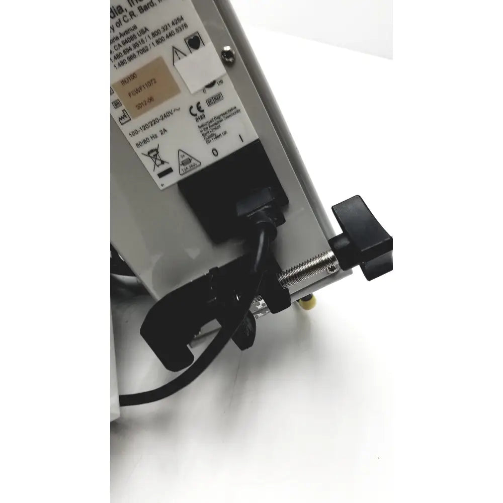 Black and silver bard peripheral flowmate industrial power supply unit with threaded knob and voltage specifications