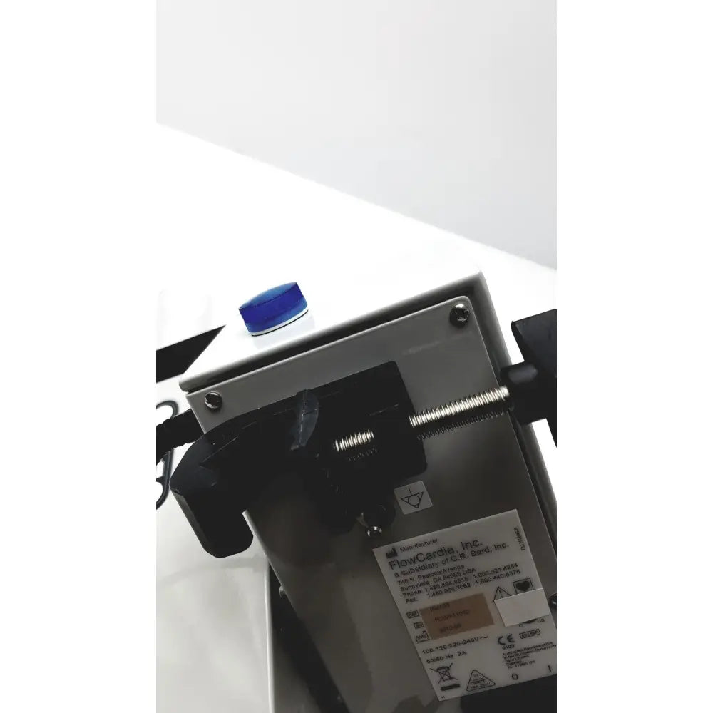 Silver metallic bard peripheral flowmate injector crosser inj100 flowcards used for precise peripheral vascular procedures