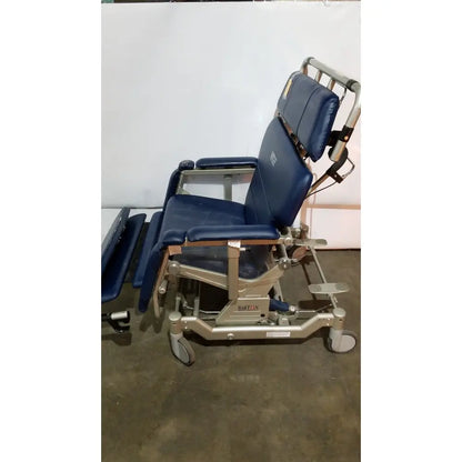 Blue padded barton convertible medical chair with adjustable sections and metal frame for patient comfort