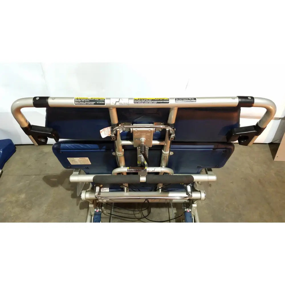 Blue padded barton convertible medical chair with silver metal frame and black grip handles for mobility support