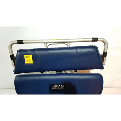 Blue padded patient lift with silver metal frame and black rubber grips on barton convertible medical chair