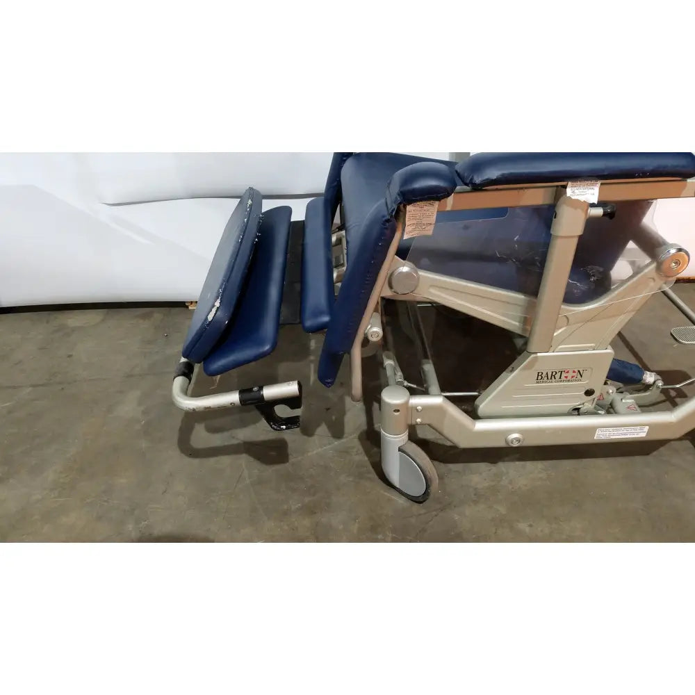Blue upholstered barton convertible medical chair with silver metal frame and casters for medical examinations