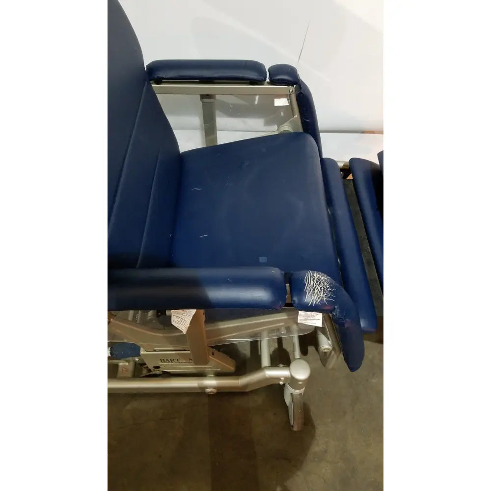 Blue upholstered barton convertible medical chair with metal frame and casters designed for medical examinations