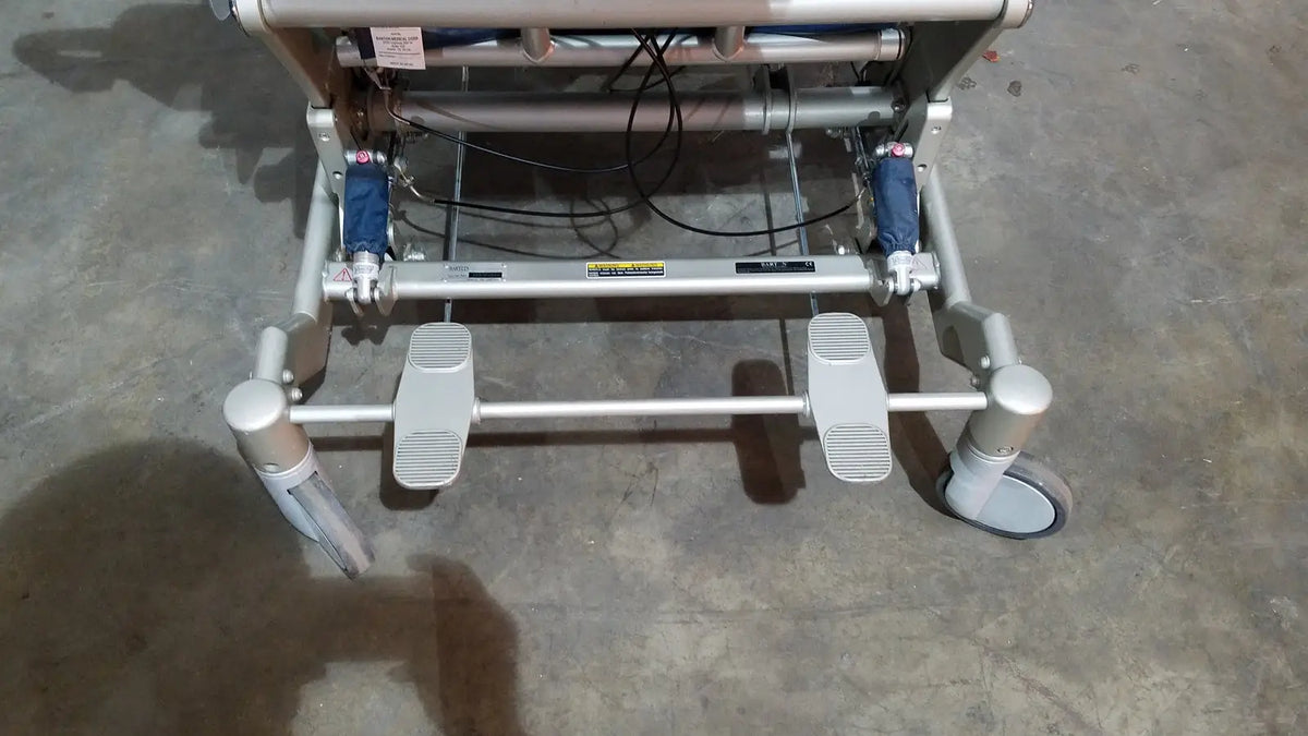 Silver-framed barton convertible medical chair with blue hydraulic cylinders and gray casters for versatile mobility