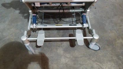 Silver-framed barton convertible medical chair with blue hydraulic cylinders and gray casters for versatile mobility