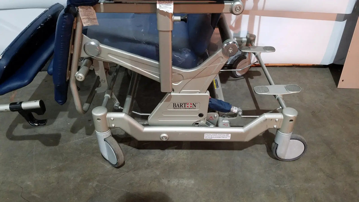 Silver metal-framed barton convertible medical chair with blue padded upholstery and four caster wheels on base