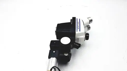 Black and white bausch lomb stereozoom 4 microscope with zoom range 0.7x to 3.0x and sturdy metallic base for reuse medical applications