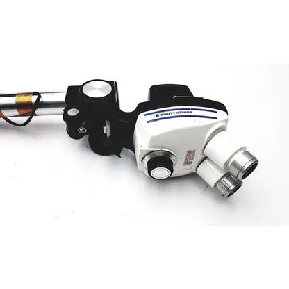 Black and white Bausch & lomb StereoZoom 4 surgical microscope with silver eyepieces and zoom range for reuse medical use