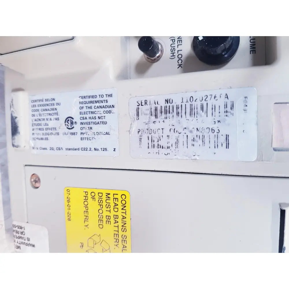 White plastic baxter 2m8063 flo-gard 6201 volumetric infusion pump with black knobs and labeled controls