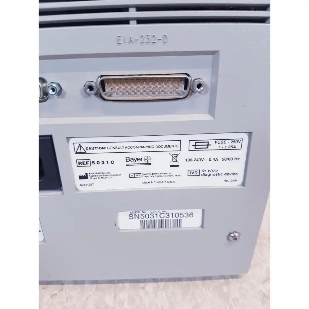 Gray plastic bayer dca 2000 plus analyzer ref back side with d-sub connector and labeled sn50c310536 specifications