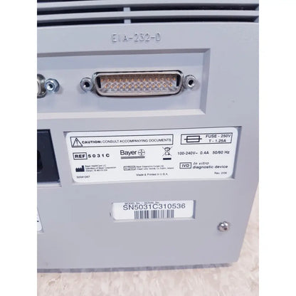 Gray plastic bayer dca 2000 plus analyzer ref back side with d-sub connector and labeled sn50c310536 specifications