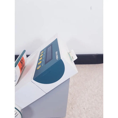 White and teal bayer dca 2000 plus analyzer ref with rectangular display, yellow buttons, and card slot sn50c310536 as is