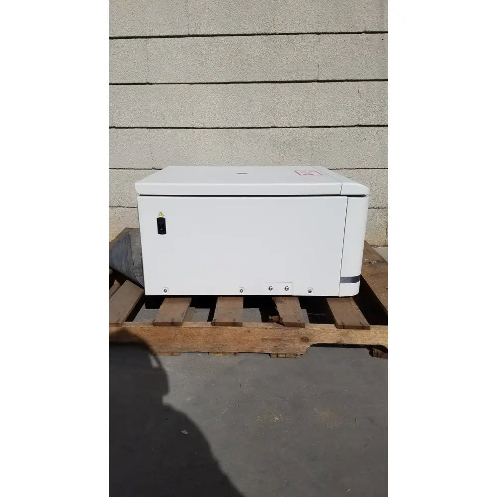 White hp printer with sleek rectangular design and gray accent strip shown with beckman coulter avanti j-15r refrigerated centrifuge